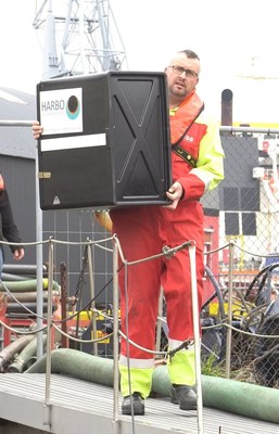 Oil spill responder carrying a 25m T-Fence™ cartridge