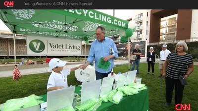 CNN Young Hero, Ryan Hickman, educating multifamily residents on the importance of recycling at a Valet Living event! (PRNewsfoto/Valet Living)