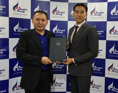 Theng Hui Low, Director of Asia Pacific for FlightAware with Mr. Kittisak Sudtachart, Director of Operations Control Center for Bangkok Airways .