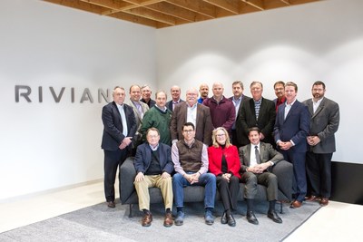 RJ Scaringe, CEO and Chairman of Rivian (seated second from left), with delegation from Bloomington