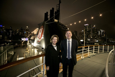 Her Majesty Queen Sonja of Norway and Daniel Skjeldam, CEO of Hurtigruten, stand together to mark the announcement of a new partnership with The Queen Sonja Print Award that will bring 600 pieces of curated art aboard the MS Roald Amundsen, the world's first hybrid battery powered ship, when it launches next year.