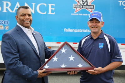 (Pictured left to right) Raymond Byrd, PepsiCo Senior Director, Fleet, and Mike Bedell, PepsiCo driver for first leg of Rolling Remembrance relay route, loading the flag onto the truck