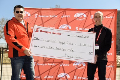 Tom Apostolis, District Vice President Montréal Centre at Scotiabank and François Lecot, Banque Scotia 21k de Montréal Race Director unveil the new fundraising record of $1.3 million from the Scotiabank Charity Challenge. Credit: Todd Fraser/Canada Running Series (CNW Group/Scotiabank)