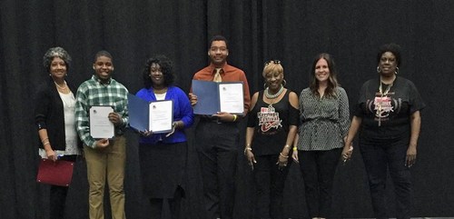 Black Heritage Festival representatives with Scholarship Committee Chairperson Theresa Garrett and CITGO Government & Public Affairs representative Jessica Marcantel awarding student scholarship recipients