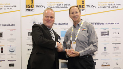 Rand Price (left), COO of the Security Industry Association, presents the New Product Showcase (NPS) award to Paul Skoog, senior product line manager for Microsemi.