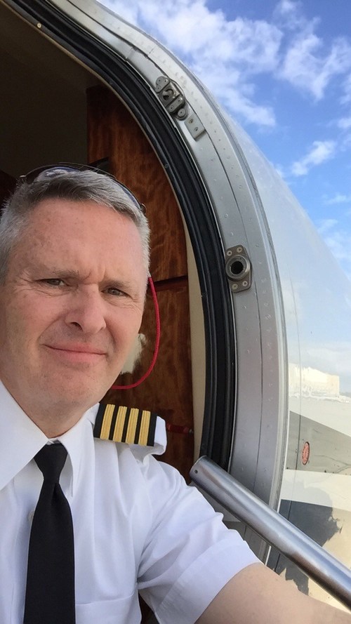 Captain Brandt at the entry door of a Cessna Citation Excel