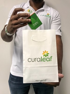 Curaleaf staff member prepares an order for delivery.