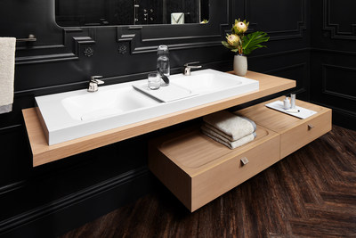 Characterized by a minimalist yet highly functional design, the DXV Modulus 55-inch lavatory, countertop slab and 36-inch wall mounted drawer seamlessly combine in a harmonious and customizable design. The collection’s single handle faucets showcase a two-tone design with their contrasting decorative rings.