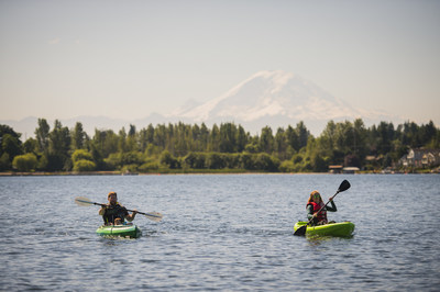 Kayakers enjoy Lake Meridian and views of Mount Rainier during a visit to Kent, Washington.