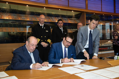 Richard Meadows, president of Seabourn, and Paolo Capobianco, director,  Fincantieri Shipyard Sestre, sign documents to complete the delivery of Seabourn Ovation today. The ship is the fifth ultra-luxury vessel in Seabourn’s fleet and will spend the summer 2018 season sailing in Northern Europe. (Photo credit: Fincantieri)