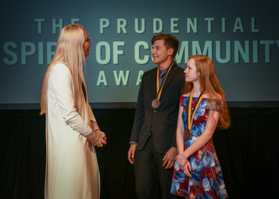 Olympic gold medalist and World Cup champion Lindsey Vonn congratulates Kaleb Cook, 18, of Robins (center) and Arika Hammond, 14, of Cherokee (right) on being named Iowa's top two youth volunteers for 2018 by The Prudential Spirit of Community Awards. Kaleb and Arika were honored at a ceremony on Sunday, April 29 at the Smithsonian's National Museum of Natural History, where they each received a $1,000 award.