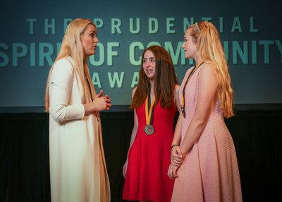 Olympic gold medalist and World Cup champion Lindsey Vonn congratulates Alexa Grabelle, 16, of Voorhees (center) and Rileigh Leighton, 14, of Williamstown (right) on being named New Jersey's top two youth volunteers for 2018 by The Prudential Spirit of Community Awards. Alexa and Rileigh were honored at a ceremony on Sunday, April 29 at the Smithsonian's National Museum of Natural History, where they each received a $1,000 award.