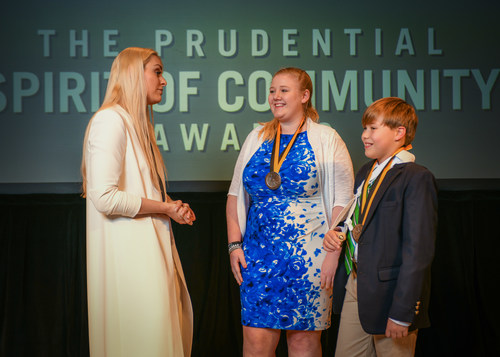 Olympic gold medalist and World Cup champion Lindsey Vonn congratulates Frances Millen, 17, of Davidson (center) and William Winslow, 12, of Raleigh (right) on being named North Carolina's top two youth volunteers for 2018 by The Prudential Spirit of Community Awards. Frances and William were honored at a ceremony on Sunday, April 29 at the Smithsonian's National Museum of Natural History, where they each received a $1,000 award.