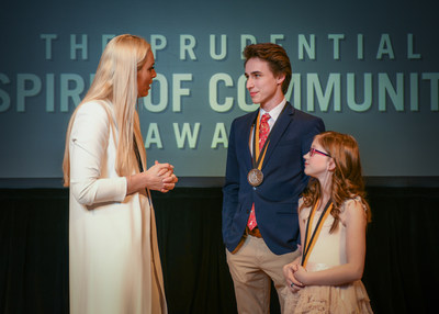 Olympic gold medalist and World Cup champion Lindsey Vonn congratulates Oscar Kavanagh, 18, of Brookings (center) and Bria Neff, 11, of Sioux Falls (right) on being named South Dakota's top two youth volunteers for 2018 by The Prudential Spirit of Community Awards. Oscar and Bria were honored at a ceremony on Sunday, April 29 at the Smithsonian's National Museum of Natural History, where they each received a $1,000 award.