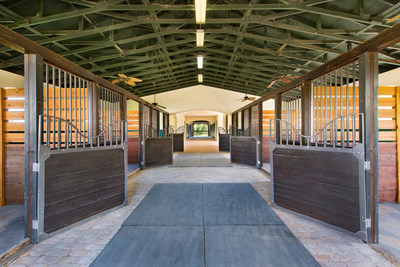 The property’s covered barn includes 12 stalls, each measuring 12-ft by 12-ft, with rubber mats laid over sand-and-clay footing. The barn was built by Linehan Builders, and is positioned such that it receives a near-constant, natural breeze through its central corridor. Learn more at WellingtonLuxuryAuction.com.