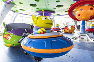 Little green aliens from the hit Disney•Pixar "Toy Story" films pilot toy rocket ships in the Alien Swirling Saucers attraction that will be part of the new Toy Story Land opening June 30, 2018, at Disney’s Hollywood Studios. With multi-colored lighting and sound effects from throughout the galaxies, Walt Disney World guests will swirl and whirl in the toy rocket ships while the aliens try to get captured by "The Claw" that hangs overhead. (Matt Stroshane, photographer)