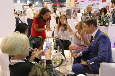 Trade attendees sampling champagne at the Champagne Lounge at ProWine Asia (Singapore) 2018 (PRNewsfoto/UBM)