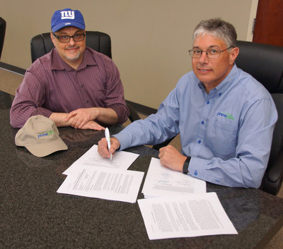 Pictured are Dave Bothwell, Chairman of the Board & CTO  and Al Bothwell, CEO as they execute the final NY Football Giants agreements.