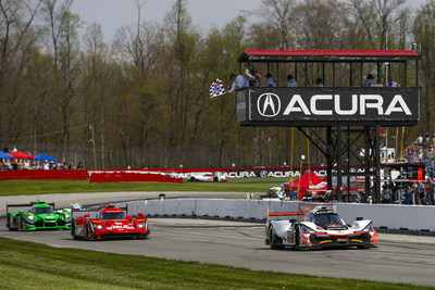 Helio Castroneves and Ricky Taylor combined to take their Acura ARX-05 to a commanding IMSA sports car victory Sunday at the Mid-Ohio Sports Car Course.