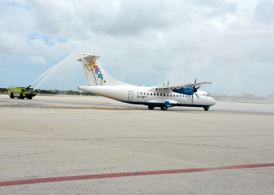 The inaugural Miami-Bimini flight receives a water-cannon salute from Miami-Dade Fire Rescue.