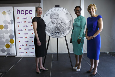 From left: Royal Canadian Mint President & CEO Sandra Hanington, Parliamentary Secretary to the Minister of International Development Celina Caesar-Chavannes and CAMH Foundation President & CEO Deborah Gillis unveil a silver collector coin celebrating the royal wedding of Prince Harry and Ms Meghan Markle (Toronto, May 9, 2018). (CNW Group/Royal Canadian Mint)