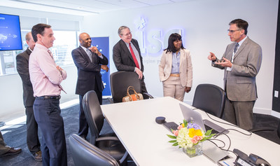 Mark Davison (right), partner, ISG Robotic Process Automation (RPA), discusses the principles of process automation with local government officials today, May 9, 2018, in the ISG Digital Experience Center, located in the new ISG global headquarters at 2187 Atlantic Street in Stamford, Connecticut.  From left are Michael Handler, chief financial officer of the City of Stamford; Michael Pollard, chief of staff to Stamford Mayor David R. Martin; Mayor Martin, and Gloria DePina, member of the Stamford Board of Representatives and an aide to U.S. Representative Jim Himes. The officials were on hand to mark the opening of ISG's new state-of-the art facility, a digital showcase for the Workplace of the Future, located in the Harbor Point area of Stamford. ISG is a leading global technology research and advisory firm and a trusted business partner to more than 700 clients, including 75 of the top 100 enterprises in the world.