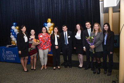 Members of the award-winning Beta Gamma Sigma Chapter at Rutgers Business School-New Brunswick pose with Michelle Tomitz (second from left) and Helen Pensavalle (second from right) of undergraduate student services at Rutgers Business School-New Brunswick.