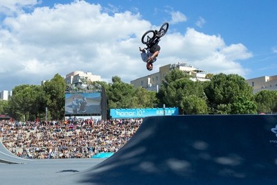 A professional BMX athlete conquering the quarter-pipe