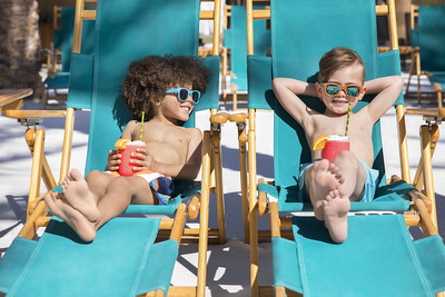 These boys are enjoying a sunny day poolside at Sunset Beach, the Fairmont Scottsdale Princess resort's newest and largest pool with 830 tons of sugar white sand, zero-entry deck, a splash pad and cabanas, with Dive In movies, Mermaid University and pirate story time on summer weekends.