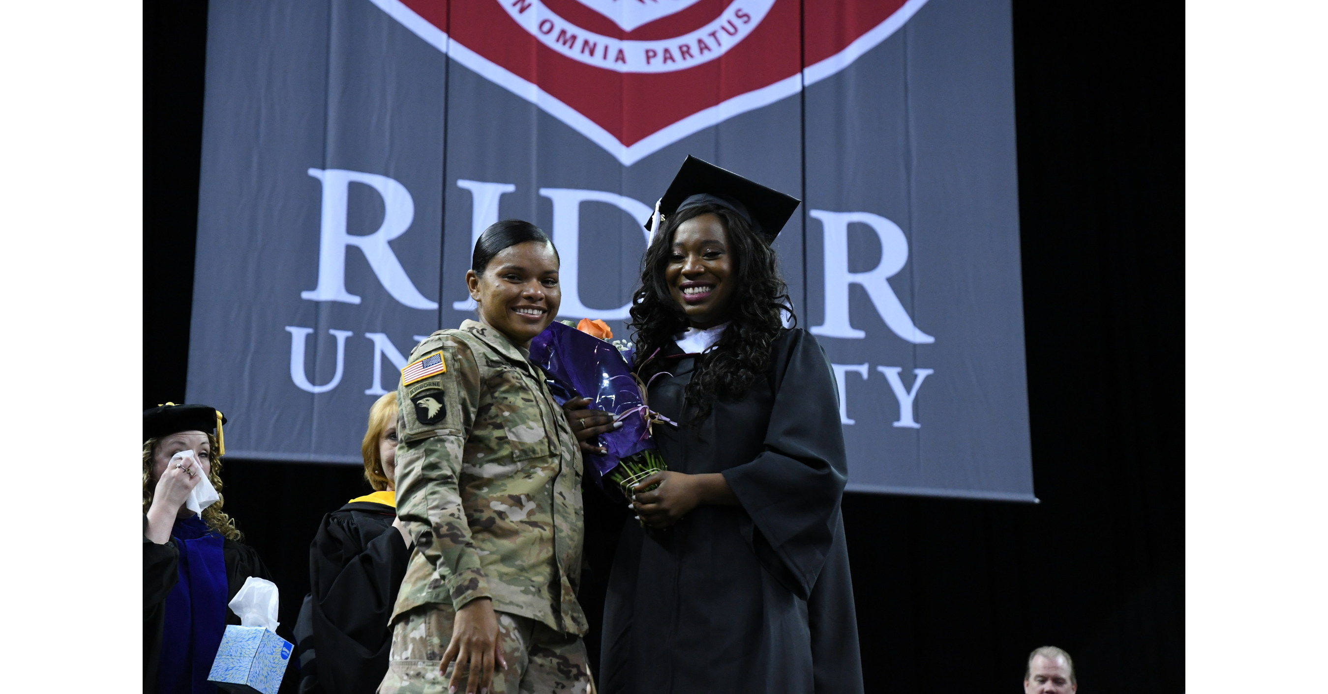 Sister Deployed to Iraq Surprises Rider University Graduate at Commencement