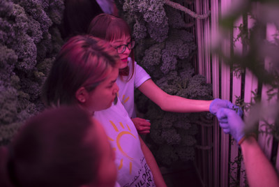 Students from La Loche Saskatchewan train to grow and harvest their own produce in the purple glow of a state-of-the-art modular farm. The $220,000 farm was granted to them by PC Children's Charity as the first of a new series of innovation grants which award transformative Canadian projects that combat childhood hunger and poor nutrition. (CNW Group/Loblaw Companies Limited)