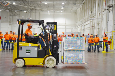 Tommy Walters, operator, unloads the first pallet of pet food into Nestlé Purina’s new distribution center in Hartwell, Georgia.