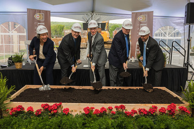 From left, Patricia Johnson, Vice President for Finance and Administration at Lehigh University; Kevin Clayton, Chairman of Lehigh Board of Trustees; John Simon, Lehigh University President, Robert Donchez, City of Bethlehem (Pa.) mayor and Tom Trubiana, EdR Collegiate Housing President, turn the dirt at a ceremony celebrating the start of construction of SouthSide Commons, a student housing community under construction at Lehigh University.