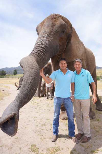 Bill Christopher (CEO) and Ken Christopher (EVP) of Christopher Ranch pictured with Butch the retired entertainment African elephant