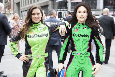 Sports icon Danica Patrick looks at her custom built LEGO life-size model, built by a team of nine designers and Master Builders over nearly 200 hours and featuring 13 different colors and 14,819 LEGO bricks, on May 22, 2018 in Times Square, New York City. (Amy Sussman/AP Images for The LEGO Group)