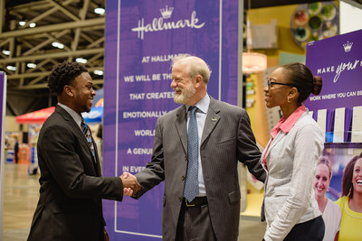 Dave Hall, President, Hallmark Cards, Inc. (center) greets students at the Hallmark booth during the Enactus United States National Exposition Career Fair where companies from around the country vied to attract exceptional talent and, in many cases, offered jobs on the spot.