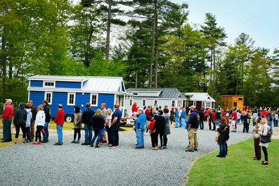 Crowds line up to get a glimpse of Petite Retreats' Tuxbury Tiny House Village. The tiny opening in South Hampton, NH celebrated Petite Retreats' first tiny house village in the Northeast.