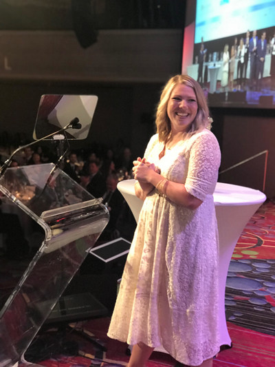 Phoenix Suns fan Whitney Collins accepts the Best in Mobile Fan Experience award on behalf of 15 Seconds of Fame during the 2018 Sports Business Awards in New York City.