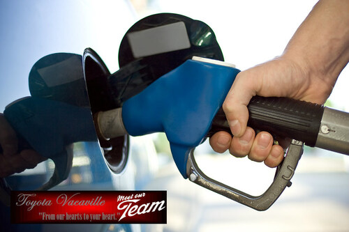 Driver filling up fuel tank at the gas pump