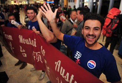 Moutai fans welcome the visiting group to Australia at Sydney Airport