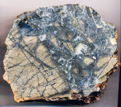 Sample P1. (0.45% Co) Buff-coloured, bleached basalt pervasively stockwork fractured grading to brecciated with in-fillings of coarse white quartz and patchy disseminations of pyrite and glaucodot (Cobalt-iron Arsenide). (CNW Group/Northern Shield Resources Inc.)