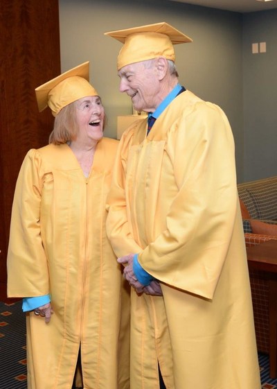 Octogenarians; Virginia Comley and James F. Comley receive Alumni Award in golden caps and gowns