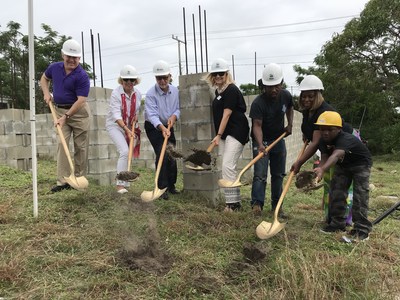 The Wright Family is pictured at right. At center is Habitat for Humanity's Board President Kerry Colvett, with BallenIsles Charities Foundation President Mark Freeman alongside BallenIsles Community Association Vice President Pat Rado. Architect David Porter is on the left.
