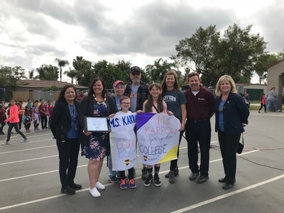 Kristin Karrow, teacher at a No Excuses University school and recipient of a full scholarship to Ashford University, with her family, principal, vice principal, and Ashford University representatives.