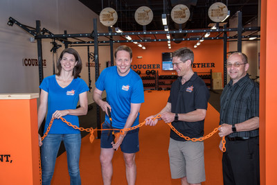 Tough Mudder Bootcamp Burlington V.I.P.'s participate in a commemorative ribbon cutting ceremony (pictured left to right: Tough Mudder SVP Cathrin Bowtell; Tough Mudder CEO/Founder, Will Dean; Burlington Franchisee Henry Pott; and Burlington Area Chamber of Commerce President, Rick Parker).