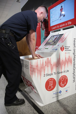 An Oakland International Airport Fire Department employee uses the Hands-Only CPR training kiosk supported by Anthem Blue Cross Foundation that debuted at Oakland International Airport. The kiosk provides Hands-Only CPR training in five minutes.