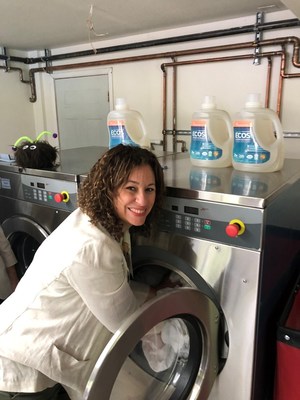President and CEO of Earth Friendly Products Kelly Vlahakis-Hanks runs a pilot load of laundry inside the new the ECOStm Laundry Room her company donated to Camp Korey in Mt. Vernon, WA, a summer camp for kids who face major medical conditions. Camp Korey and Earth Friendly Products, maker of the number one selling green laundry detergent in the U.S., joined together to build the ECOStm Laundry Room to support the health of the camp-goers. Earth Friendly Products makes its green cleaning products in Lacey, Washington, and three other sustainable facilities nationwide. The new Camp Korey opened with a ribbon-cutting ceremony with local dignitaries on Saturday June 2, 2018.