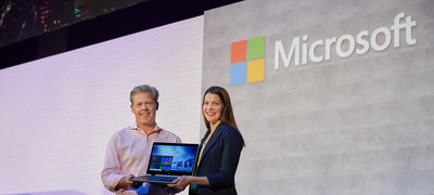 Microsoft’s Nick Parker, corporate vice president, Consumer and Device Sales and Roanne Sones, corporate vice president, Platforms, Microsoft Corp. unveil the new HP ProBook x360 on stage at Computex 2018.