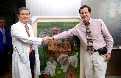 Korean professor Hwang Wook-suk greets Davis Hawn at SOOAM Biotech. Hawn will ask his Korean friends to help him clone his Service Dog Booster once again so that he can gift it to the North Korean leader Kim Jong-un.