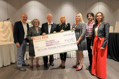 Pizza Nova President, Domenic Primucci (left), Founder Sam Primucci (middle) and family members present the proceeds in an official cheque presentation ceremony to Oriel Thomson, Partnership & Resource Development Manager of Student Nutrition Ontario. (CNW Group/Pizza Nova)